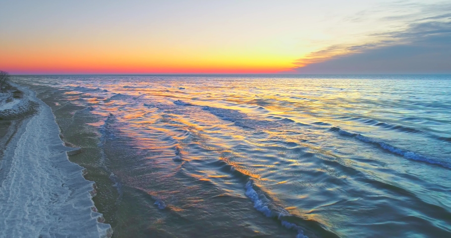 Exceptionally scenic Winter landscape on Lake Michigan shoreline at sunrise, aerial view.
