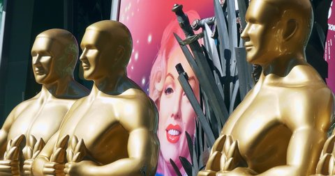 LOS ANGELES, CALIFORNIA, USA - FEBRUARY 7, 2020: Statues of Oscar with Marilyn Monroe on background prior to Oscar academy award nomination in Los Angeles, California 4K