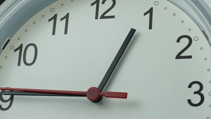 Close up Move the camera angle, Twelve o'clock White clock on black background, Time lapse 30 minutes moving fast.