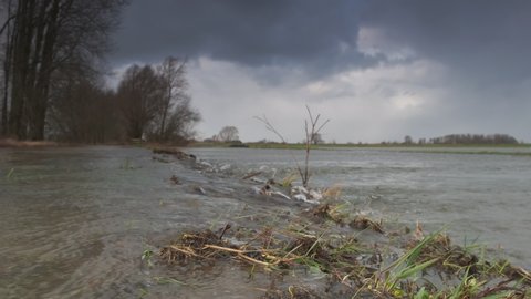 Water running over the floodplains of the river IJssel during flooding caused by high water levels in the river in Overijssel The Netherlands