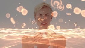 Animation of yellow macro corona virus and bacteria spreading and floating with a sick Caucasian woman sneezing using tissues in the background. Global health warning scare spreading infections - Powered by Shutterstock - Get 15% off with code: PIKWIZARD15