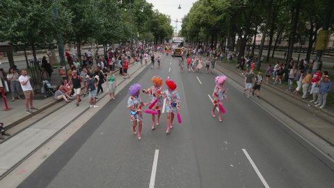 VIENNA AUSTRIA June 16 2018 – LBGT rainbow parade, gay pride parade, Regenbogenparade at the Ringstrasse Wien, moving shot of 4 drag queens walking along the street followed by a party truck, sound