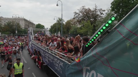 VIENNA AUSTRIA June 16 2018 – LBGT rainbow parade, gay pride parade, Regenbogenparade at the Ringstrasse Wien, close up moving Segway shot of people dancing on a party truck, many spectators, sound