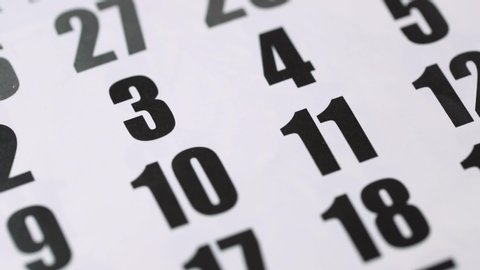 Mark the 3rd number on the calendar with a red marker. A black number 3 is circled in a red circle. Close-up, top view.