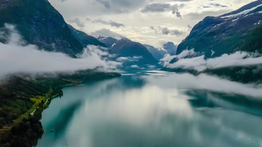 Beautiful Nature Norway natural landscape lovatnet lake flying over the clouds. | Shutterstock HD Video #1046650240