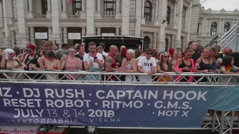 VIENNA AUSTRIA June 16 2018 – LBGT rainbow parade, gay pride parade, Regenbogenparade at the Ringstrasse Wien, people dancing on a party truck with music passing by, spectators and  Burgtheater, sound