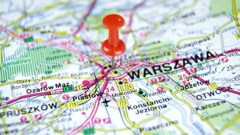 Warsaw pinned on a map of Europe. Close up of a road map of Warsaw. Warsaw, a close up shot of capital of Poland on map. Travel and tourism concept