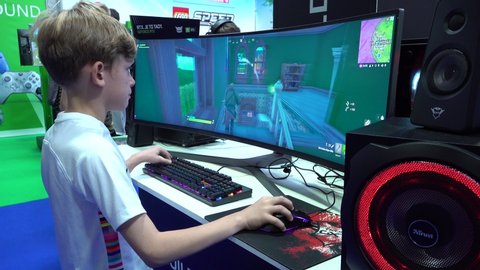 PRAGUE, CZECH REPUBLIC - OCTOBER 17, 2019: An exhibition of video games, a young boy plays a game called Fortnite.