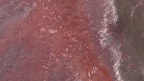 Aerial shot. Aerial view of the remains of the Owens Lake, in the USA in California. Red colour in the water are caused by two bacterium highly resistant to salt, Halobacterium and Halococci bacteria. - Powered by Shutterstock - Get 15% off with code: PIKWIZARD15