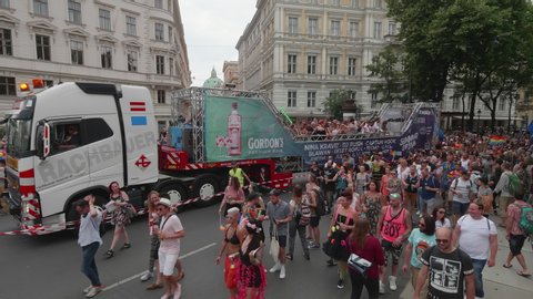 VIENNA AUSTRIA June 16 2018 LBGT rainbow parade gay pride parade, Regenbogenparade at the Ringstrasse Wien, moving Segway shot of people marching along a party truck at the Schwarzenbergplatz, sound