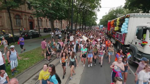 VIENNA AUSTRIA June 16 2018 LBGT rainbow parade gay pride parade, Regenbogenparade at the Ringstrasse Wien, moving Segway shot of young people dancing on the street next to a music truck, with sound