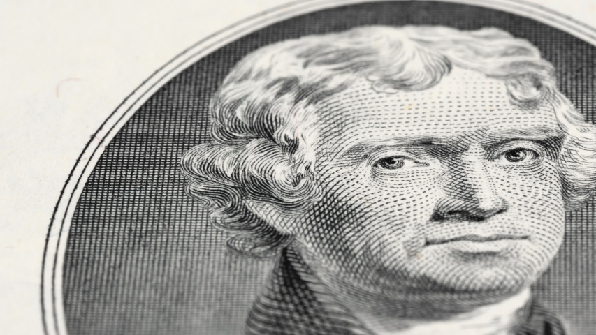 US President Thomas Jefferson on 2 dollar bill tracking, two USD. Low angle, macro. 4K