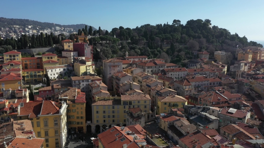 Nice, France. Aerial top view the hilly cityscape with green park.Mediterranean sea and mountains on the background
