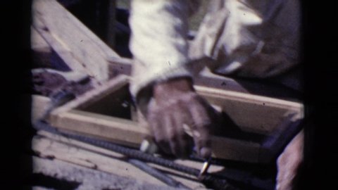 COTTONWOOD ARIZONA-1968: A Mason Or Builder Lays Bricks With Concrete Or Mud