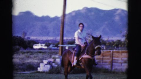 COTTONWOOD ARIZONA-1968: Woman Practicing Equestrian In Beautiful Rural Property On A Very Well Trained Horse