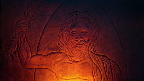 Zeus Carving Ancient Greek God Lit Up In Firelight