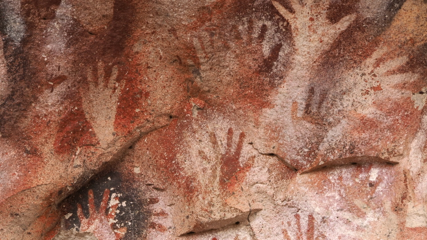 Prehistoric hand paintings at the Cave of Hands (Spanish: Cueva de Las Manos) in Santa Cruz Province, Patagonia, Argentina. The art in the cave dates from 13,000 to 9,000 years ago. Royalty-Free Stock Footage #1046730424