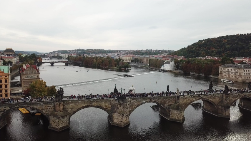 Aerial view flying over Charles Bridge to see River Vltava