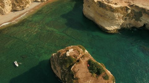 Roucheh rocks in Beirut, Lebanon in the sea in 4K quality, Pigeon Rocks in Mediterranean sea.
