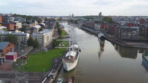 TURKU, FINLAND - August 2019: Aerial view of Swan of Finland sailing ship and the skyline of Turku in Finland