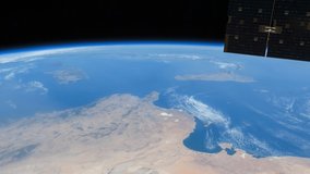 International Space Station view of rotating cloudy planet earth above Mediterranean Sea. Created from Public Domain images, courtesy of NASA Johnson Space Center.