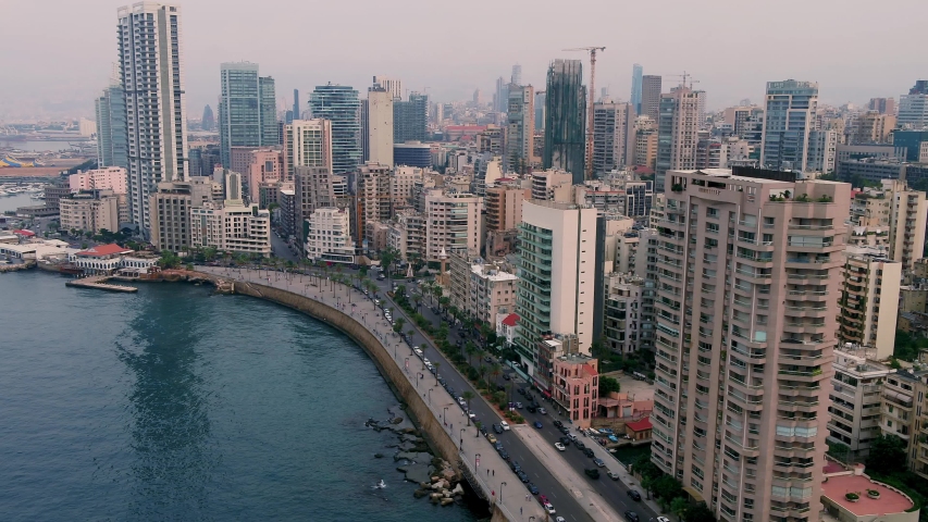 Beirut's corniche sea front with high rise residential buildings and pedestrian walkway along the Mediterranean sea, Lebanon
 Royalty-Free Stock Footage #1046753200