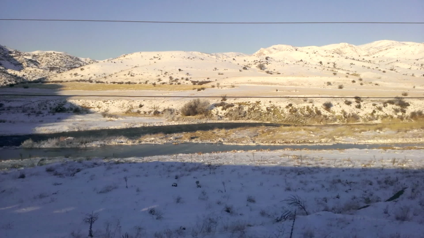 Cozy train ride among snowy mountains Erzurum of Turkey famous Eastern Express "Dogu ekspresi" passes cities of Ankara, Kırıkkale, Kayseri, Sivas, Erzincan, Erzurum and Kars