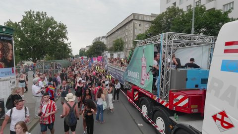 VIENNA AUSTRIA June 16 2018 LBGT rainbow parade gay pride parade, Regenbogenparade at the Ringstrasse Albertina Wien, moving Segway shot of people marching on the street next to a party truck, sound