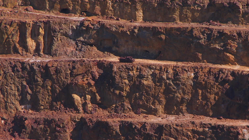 un-zoom on an old terraced open pit mine, close to the sources of the River Rio Tinto, Spain. Its source in Andalusia,  where you can find the largest open pit copper mines  of Europe.