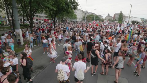VIENNA AUSTRIA June 16 2018 LBGT rainbow parade gay pride parade, Regenbogenparade at the Ringstrasse Wien, moving Segway dolly shot, camera is following people from behind marching the parade, sound