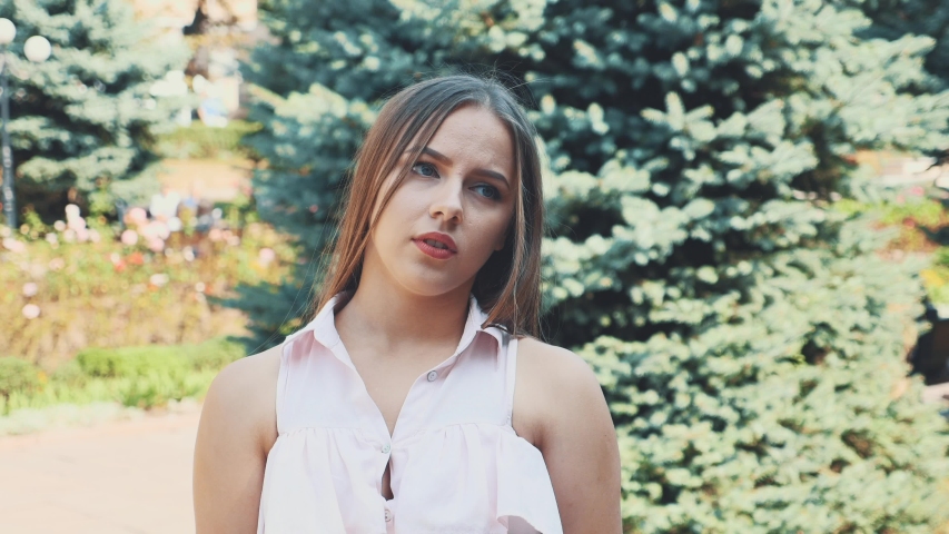 Young attractive blond woman is lost and depressted. Action. Movement. 4K.