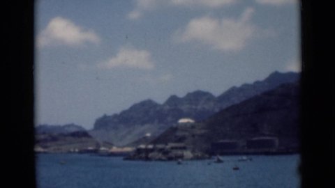 ADEN YEMEN-1946: View Of A Body Of Water With Tall Hills In The Background