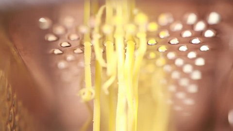 Hand grating yellow cheese with a metal grater. Closeup. Editing ready for use.