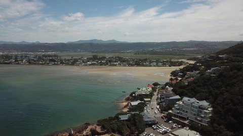 4K summer day aerial drone video: Featherbed Nature Reserve, Knysna River lagoon, Eastern and Western Heads straight to Indian Ocean in Knysna, Garden Route, Western Cape, South Africa