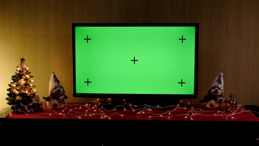 Christmas TV with green screen composited. TV or television - green screen - room - on the table. Christmas time