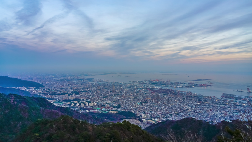 Kobe City panoramic view time-lapse sunset to night, from Mt Maya Kikuseidai park observatory platform in sunny day with colorful sky background, 10 ten million dollar night views. Hyogo Prefecture