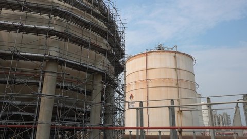 Large industrial tanks or spherical tanks and have scaffold installation work for petrochemical plant, oil and gas fuel or water in refinery or power plant for industrial plant.
