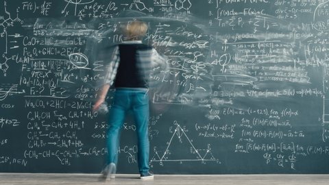 Time-lapse of creative male teacher young man writing formulas on chalkboard in classroom moving near board working alone. People and occupation concept.