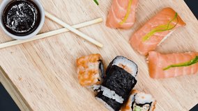 Close Up Of Various Types Of Japanese Fresh Prepared Sushi . Top view dynamic rotation footage .