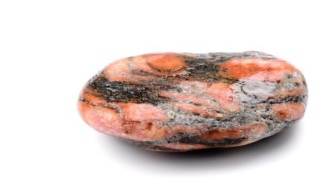 Gneiss with red feldpsar eyes on a turn table