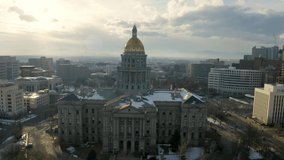 4k Aerial drone footage - Colorado State Capitol Building & the Skyline of the City of Denver Colorado at Sunset.	
