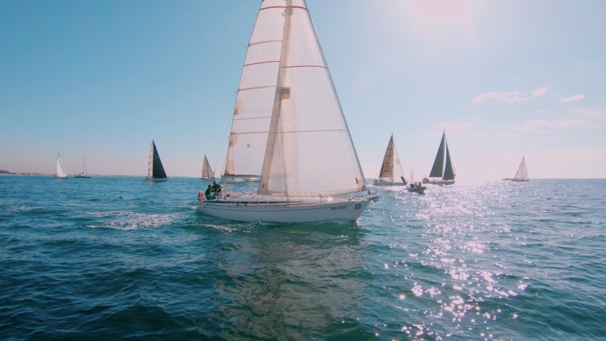 Regatta or sailing race at mediterannean sea. Sunny summer day, happy and excited people on sailboat or yacht. Amazing idea for summer holiday. Travel destination