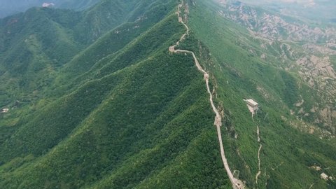 Aerial view of Great Wall of China. Famous landmark Great Wall and mountains located in Hebei province next to Beijing.