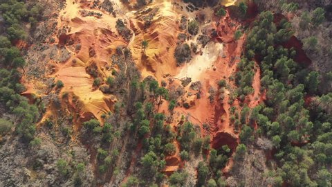 Aerial shot red soil ochre texture abstract pine trees Colorado Provencal Rustrel France