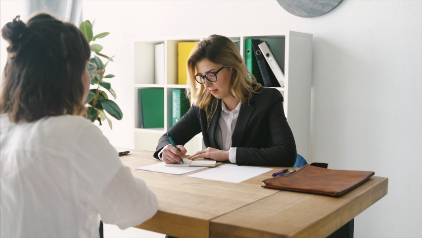 Young female candidate interviewed by employer