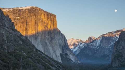 Yosemite Valley Tunnel View at Sunset in Winter. El Capitan and Half Dome. Sunny Evening, Full Moon. California, USA. Time Lapse. Medium Shot