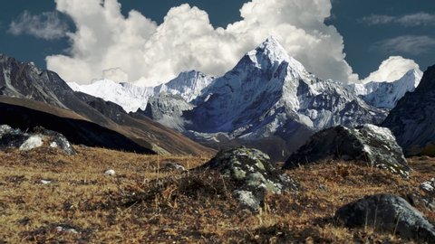 Great view of Ama Dablam mountain on the trek to Everest Base Camp. Nepal, Himalayas mountains. Steadicam shot of snowy Himalayas and running clouds. UHD, 4K