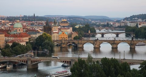 Scenic summer sunset aerial view of the Prague Old Town pier architecture and Charles Bridge over Vltava river in Prague, Czech Republic