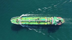 Aerial drone top down video of petrochemical tanker ship cruising Mediterranean open sea