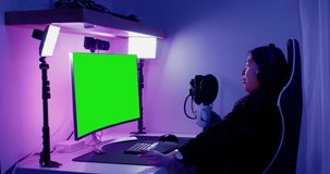 GREEN SCREEN CHORMA KEY Korean teen recording a podcast or doing live stream from home, bedroom interior. 4K UHD RAW graded footage